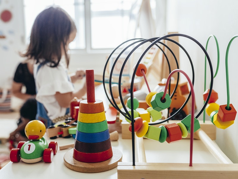 Young girl playing with montessori educational toys